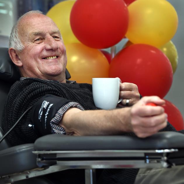 David Bond prepares to give his 304th donation of blood — not shaken or stirred — as part of...