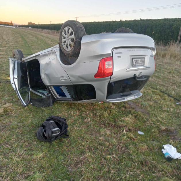 The driver of this Toyota Corolla walked away after it rolled multiple times into a field on...