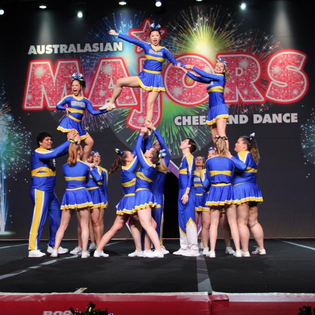 The Dynasty University of Otago competitive cheerleading team complete one of the manoeuvres that...