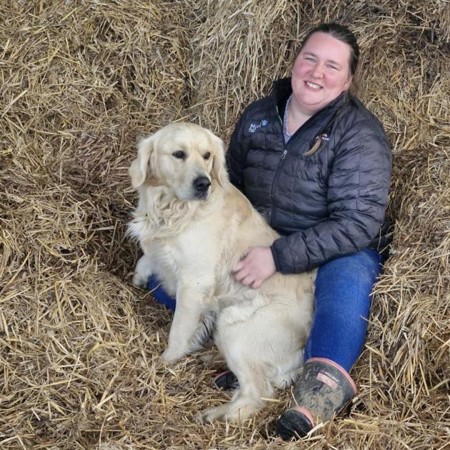 No place like home ... Farm consultant Lutte Thys, pictured with dog Chumu, has studied dairy...