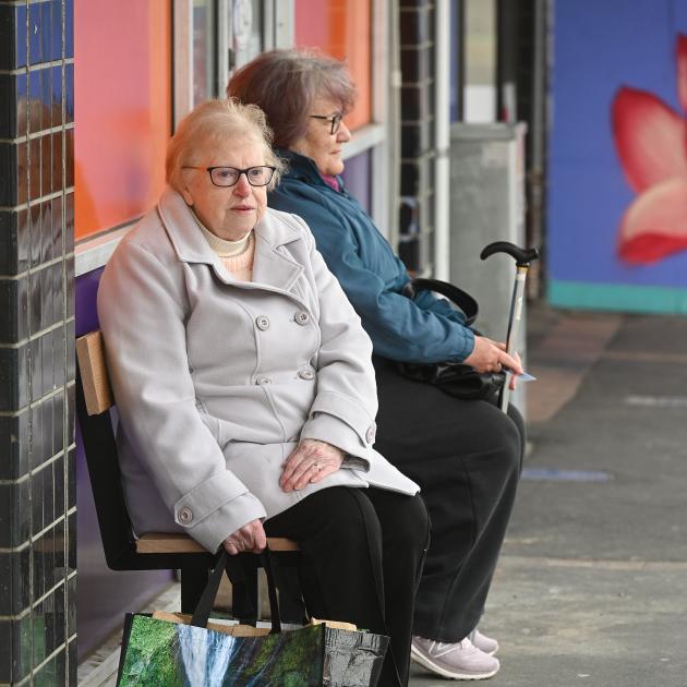 Grey Power Otago president Jo Millar (left) sits on a recently installed seat at the King Edward...