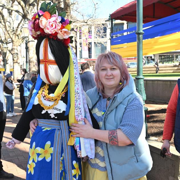 Ukrainian Dunedin resident Olha Viazenko with Motrya the motanka (doll) in the Octagon for...