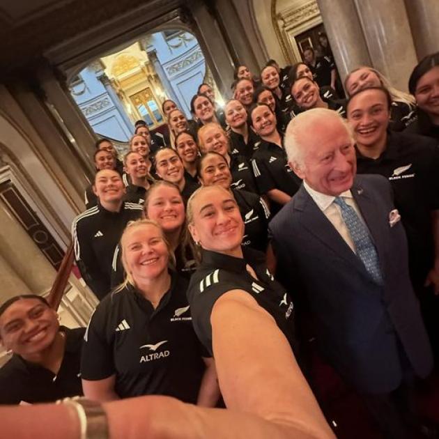 Britain's King Charles III poses for a photograph with members of New Zealand's Black Ferns rugby...