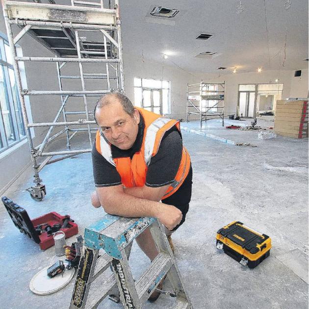 Rangiora Presbyterian minister Rev Jason King gets the feel of his new pulpit area inside the new...