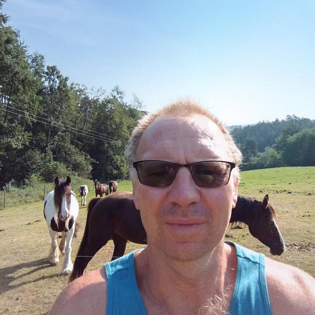 John Barker and his horses at home in the Czech Republic.