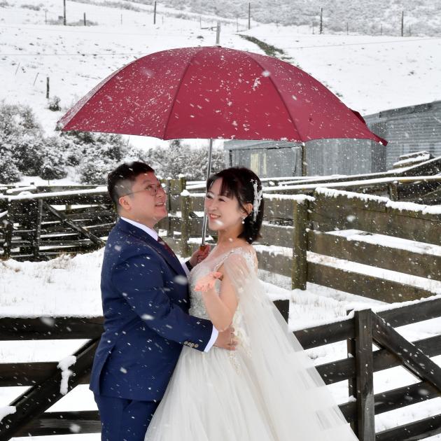 Drs Alison Ou and Crystal Sun pose for wedding photos in the Lindis Valley. PHOTO: STEPHEN JAQUIERY