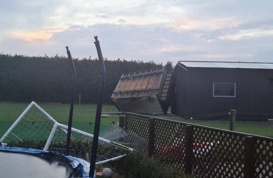 Wild winds hit Methven, flipping a chicken house, downing trees and silos blown over. Photo:...