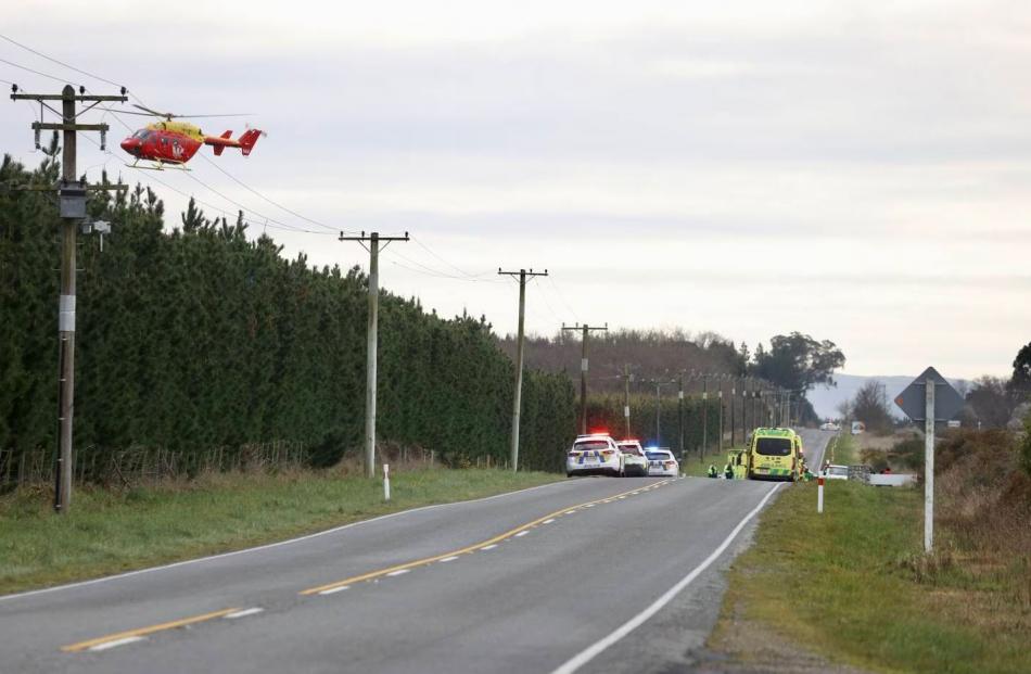 A helicopter leaves the scene. Photo: George Heard