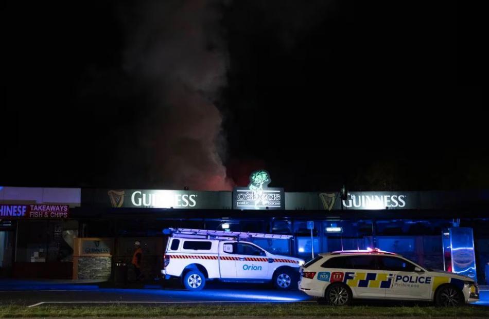 Smoke rising from the outdoor area at the back of O’Shea’s Pub. Photo: George Heard