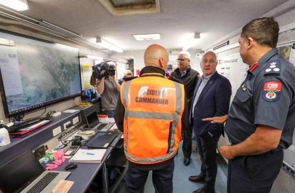 Christopher Luxon meets with emergency services on Port Hills. Photo: RNZ / Nathan Mckinnon