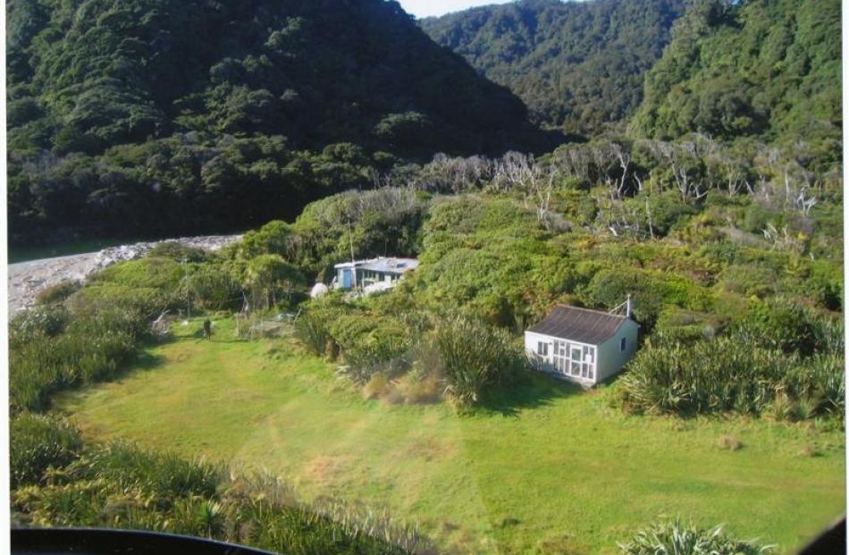 Their home from the air, with a Department of Conservation hut to the right and airstrip in front.