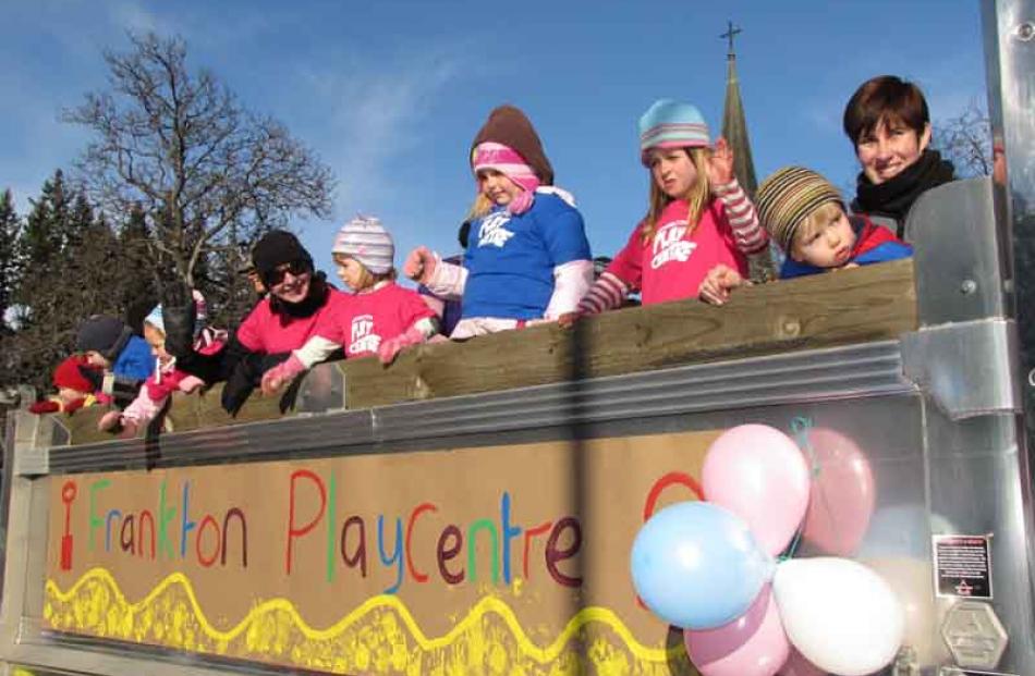 Frankton Playcentre youngsters wave to the crowds.