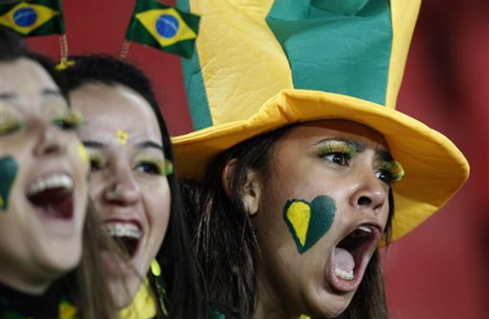 Brazil fans cheer prior to the World Cup round of 16 soccer match between Brazil and Chile at...