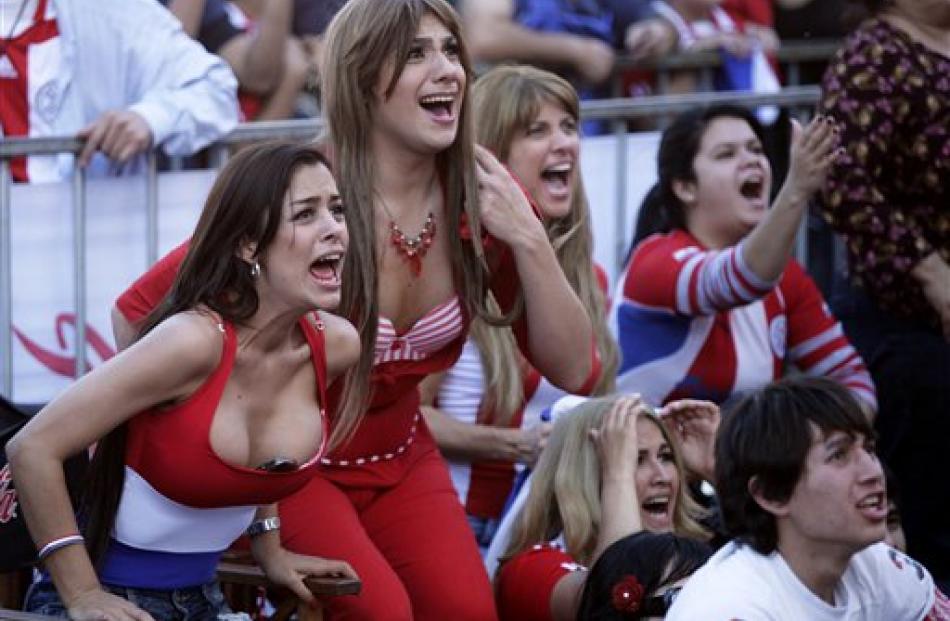 Paraguay fans celebrate their team beating New Zealand, in Asuncion, Paraguay. (AP Photo/Jorge...