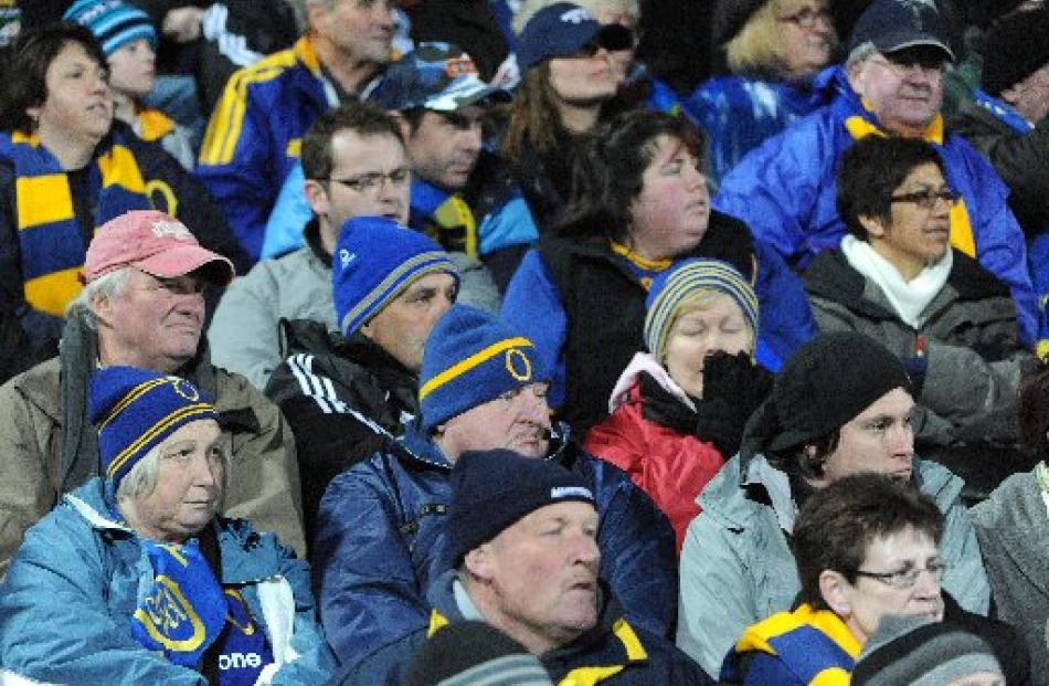 Dejected Otago supporters watch the final minutes of the Ranfurly Shield clash at Rugby Park,...