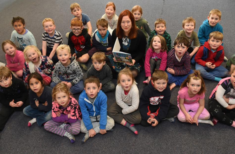 Year 1-3 Port Chalmers School pupils surround author illustrator Kathryn van Beek during her visit to the school yesterday to read her book about Bruce the cat and his life in Port Chalmers. Photos: Gregor Richardson.
