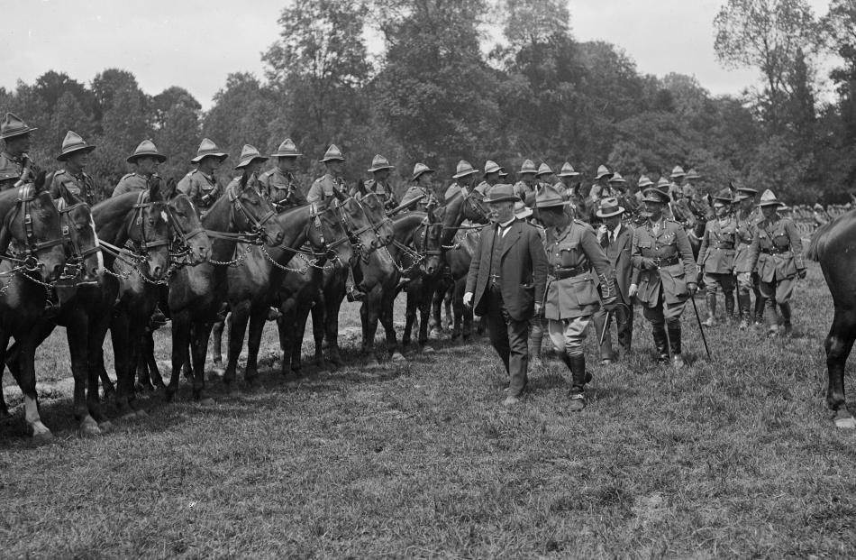 Prime Minister Massey and Sir Joseph Ward inspect the Otago Mounted Rifles, France, 1918. REF: 1...