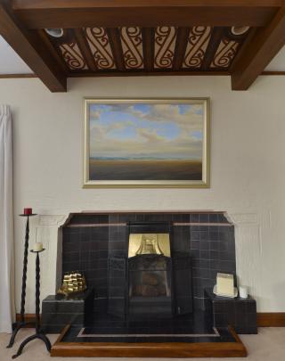 A ceiling panel with Maori motifs is a feature of the  lounge. The painting is Oreti Beach, by...