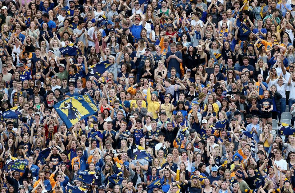 Members of the 16,687-strong crowd cheer on the Highlanders during their opening Super Rugby match against the Blues at Forsyth Barr Stadium in Dunedin last night. 