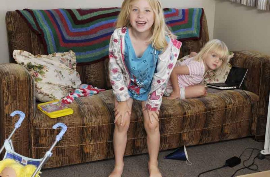 Macy (5) and Tori Hill (3), of Auckland relax at the crib.