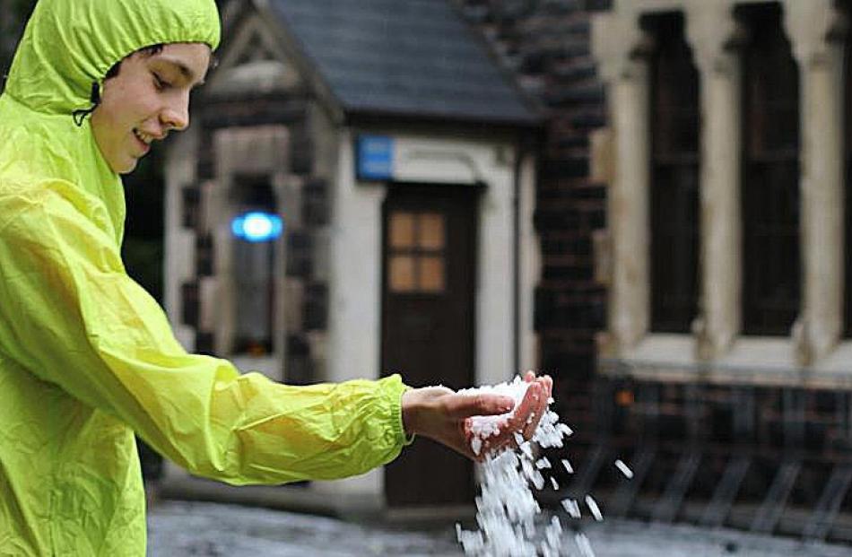 Odin Jacobs (14) handles some of the heavy hail which fell at the University of Otago in Dunedin...