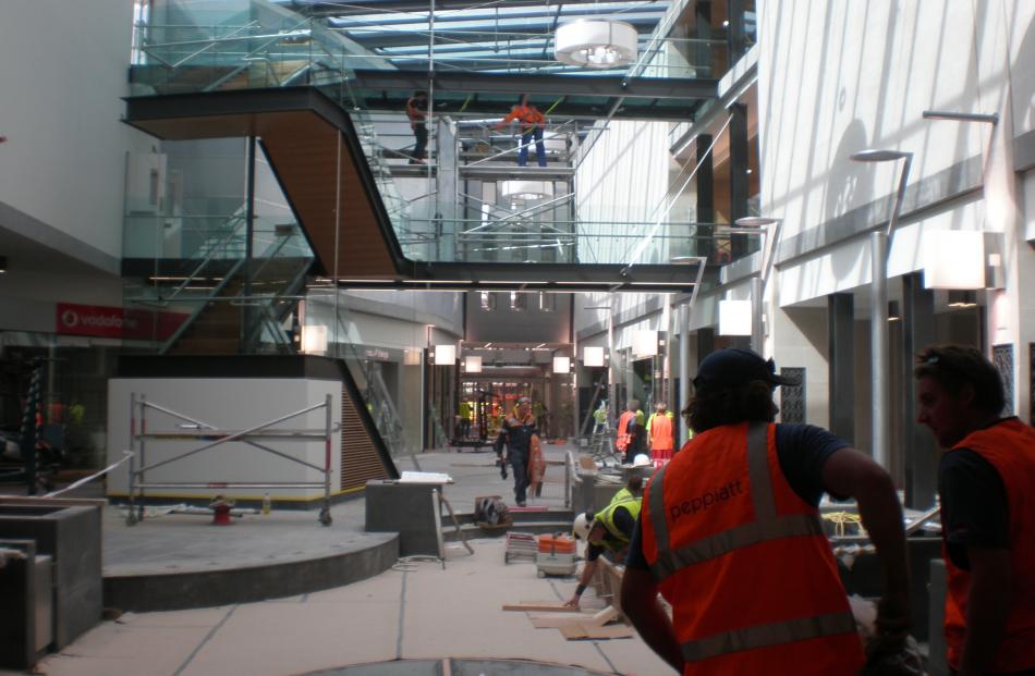 A quick glance at contractors working on site at Wall Street Mall.