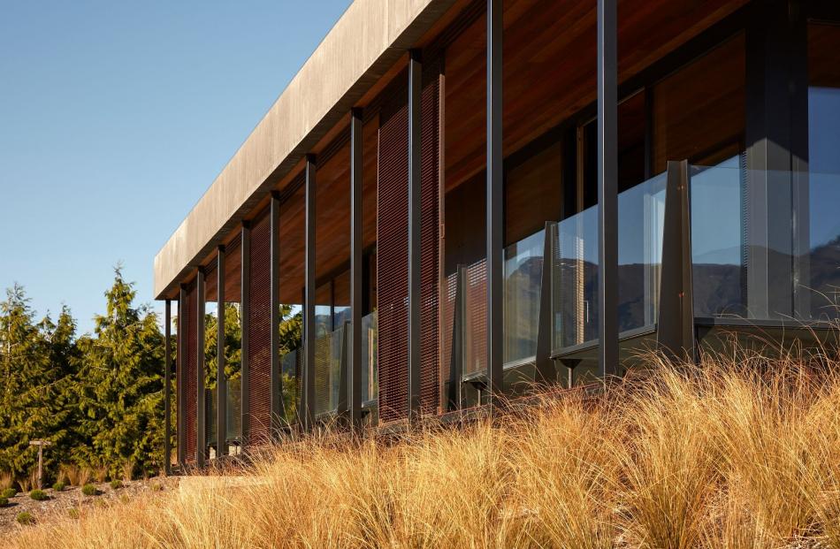 Mesh sliding screens on the veranda filter harsh summer sunlight entering the living areas.