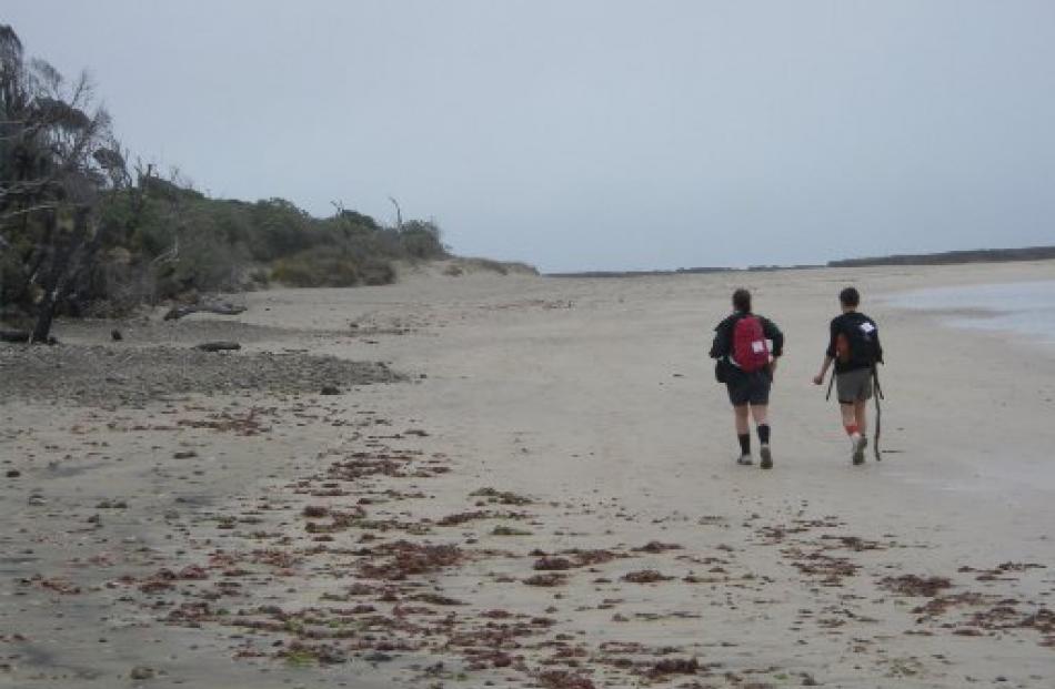 Megan Somerville (left) and Beth Romeril cross one of the beaches on the last leg of the Hump Track.