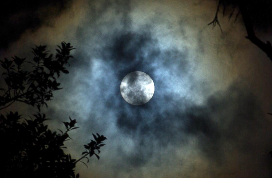 A photo of the transit of Venus through cloud, by Derek Gunn.