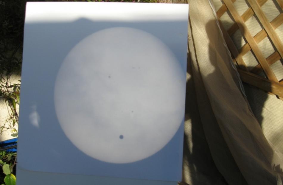 Vaugn Malkin submitted this image. The sun was projected through a telescope onto a screen and...