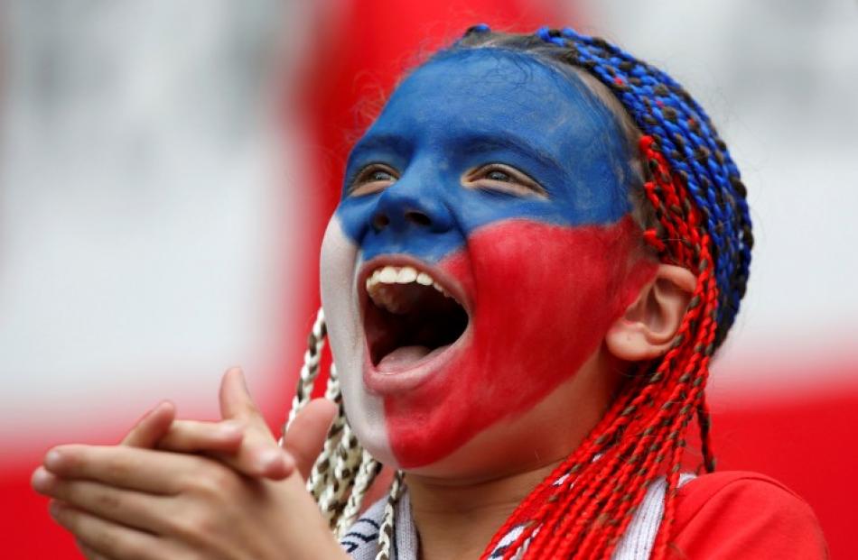 A Czech Republic supporter cheers her team on against Greece in Wroclaw.