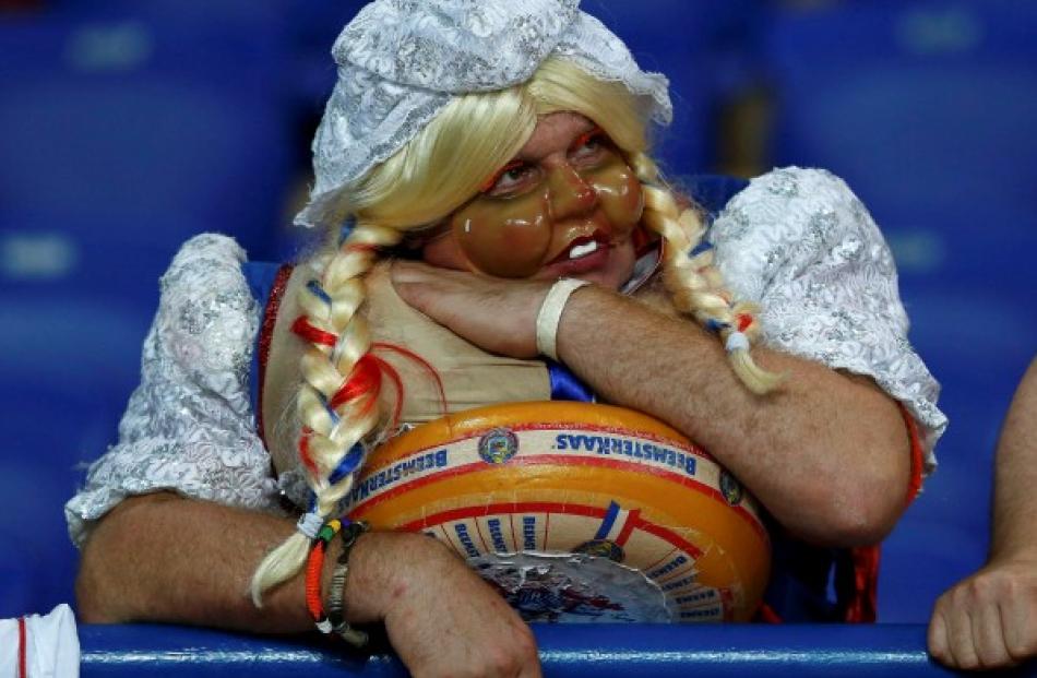 A Dutch fan shows his disappointment after his team's match against Germany in Kharkiv.