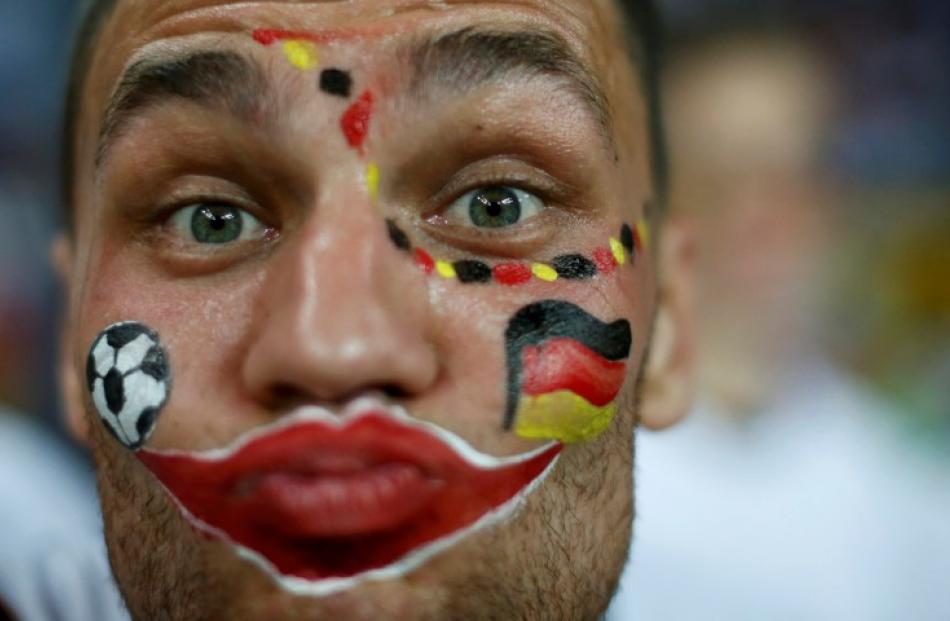 A German supporter  gets into the spirit before the match against Netherlands in Kharkiv.