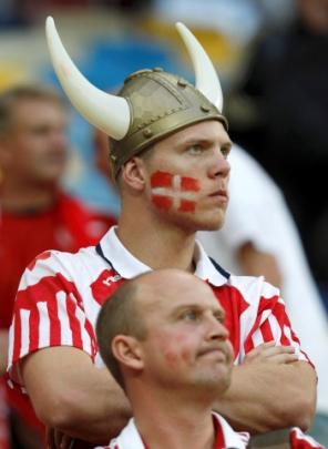 Danish fans react after the Portugal match in Lviv.