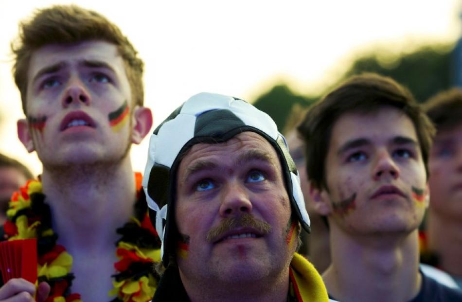 Fans watch a public screening of the Germany v Netherlands match at the Fan Mile in Berlin....