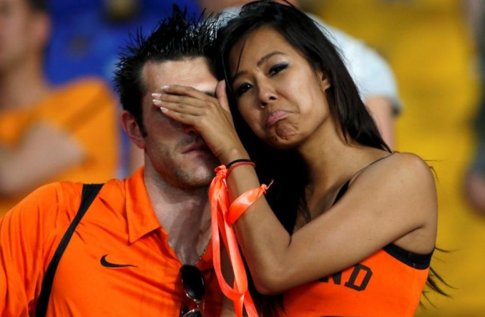 Netherlands supporters react at the end of their team's Group B match against Germany in Kharkiv.