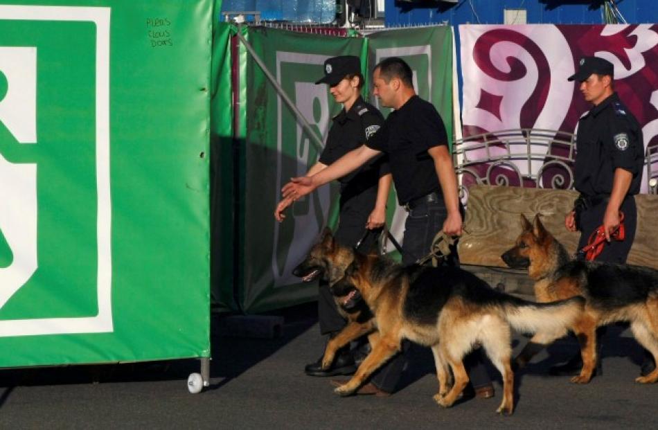 Police patrol with dogs in the fan zone in Kiev.