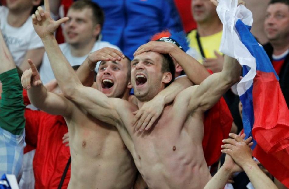 Russian fans celebrate during their Group A match against Czech Republic in Wroclaw.