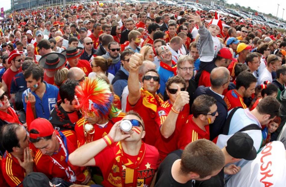 Spanish fans cheer outside PGE Arena before their team's first match, against Italy, in Gdansk.