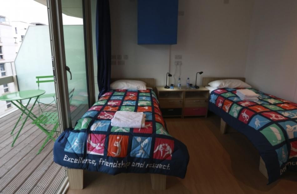 A twin bedroom and balcony in the Olympic Village. Photo by Reuters.