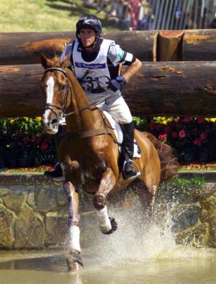 Blyth Tait takes Ready Teddy through the water on the cross-country course at the 2000 Sydney...