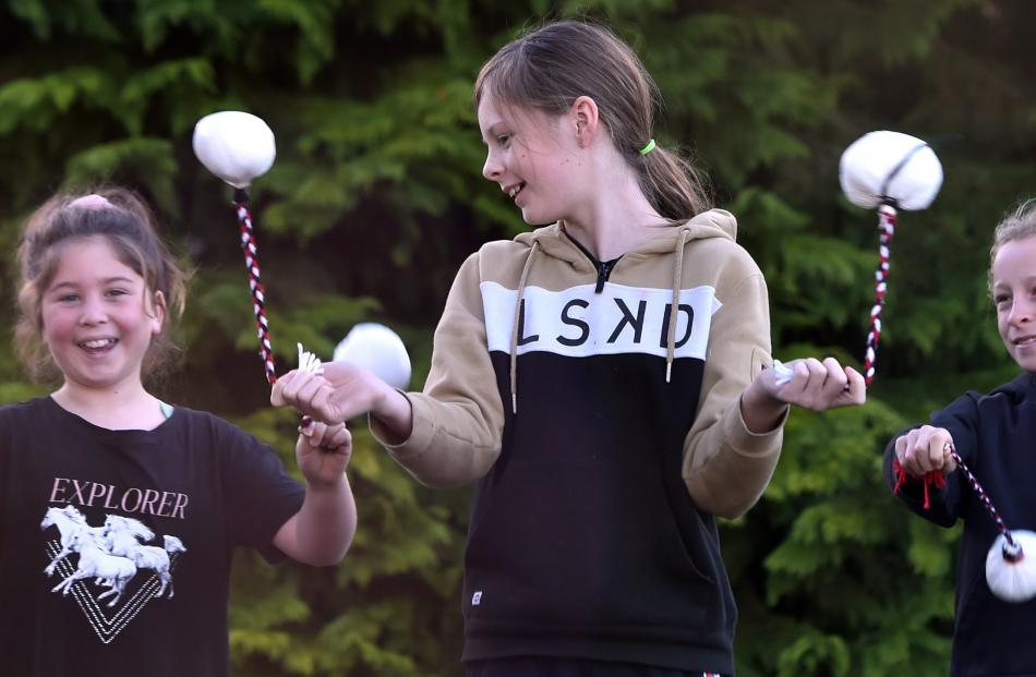 Practising poi skills are (from left) Lee Stream School pupil Bella Nichol (10), Macraes...