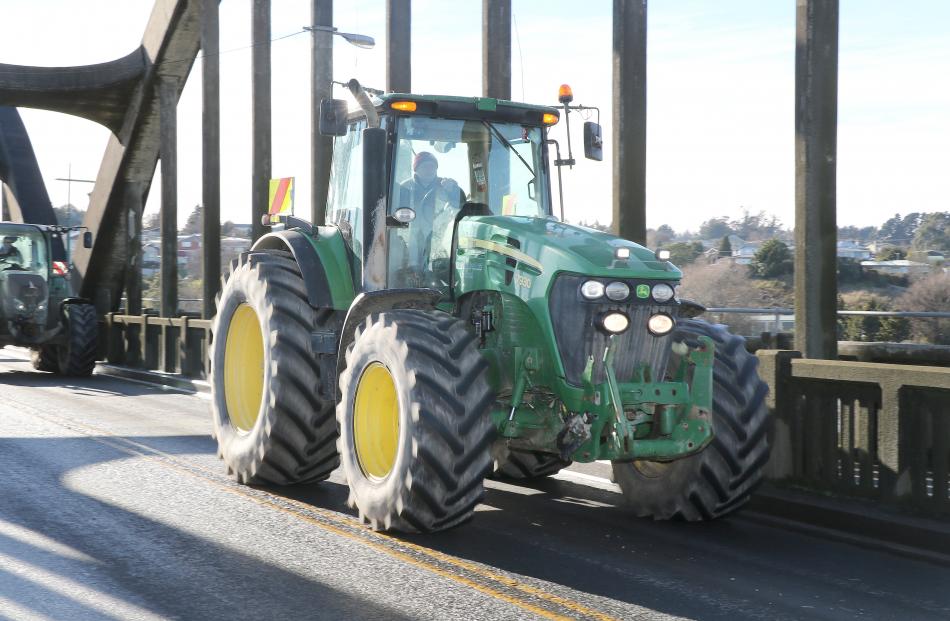 A tractor crosses the Clutha River bridge in Balclutha.PHOTO: JOHN COSGROVE

