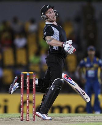 Brendon McCullum avoids a bouncer from Sri Lanka's Lasith Malinga during
...