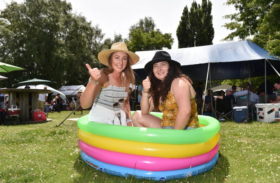 Tahlia Dean (left), of Omakau, and Shaye Scott, of Poolburn, cool off in their inflatable drinks...