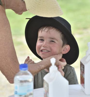 Marko Dorrance (3), of Christchurch, gets some sunscreen protection from Nana.