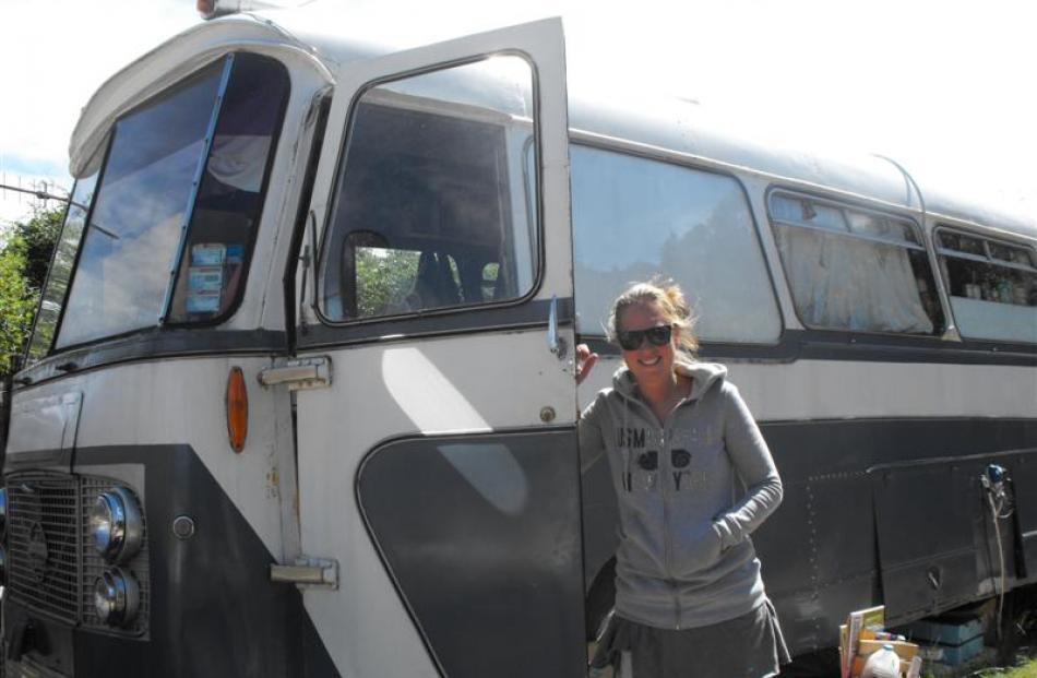 Camping ground resident and manager Suzan Spoelstra stands outside the old bus from Riverton...
