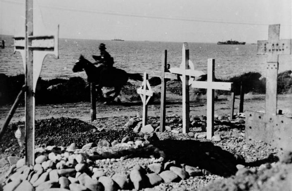 A horseman passes a Gallipoli cemetery. Photos from Hocken Collections, Uare Taoka O Hakena,...