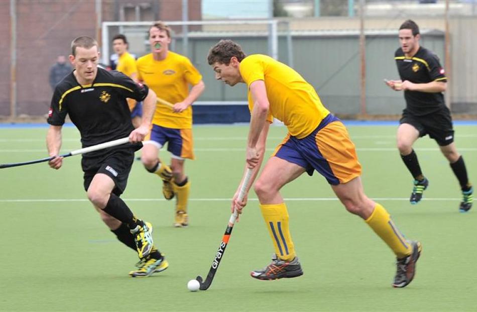 Southern's Callum Bailey (right) dribbles past Capital's Steve Crossett during the national...