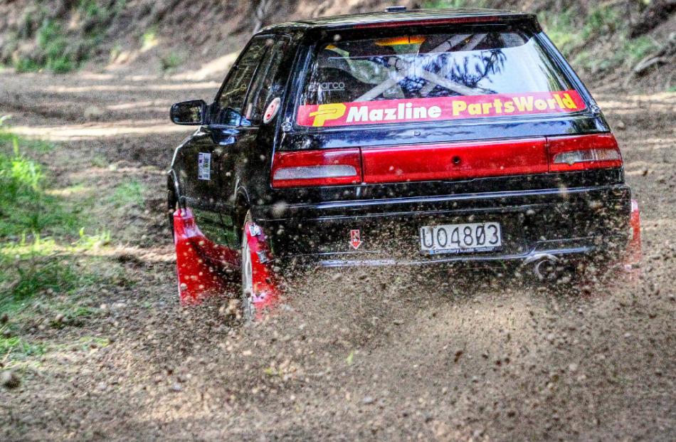 High speed corner . . .Justin Prattley of Christchurch. Full Group A rally car his Mazda 323. ...